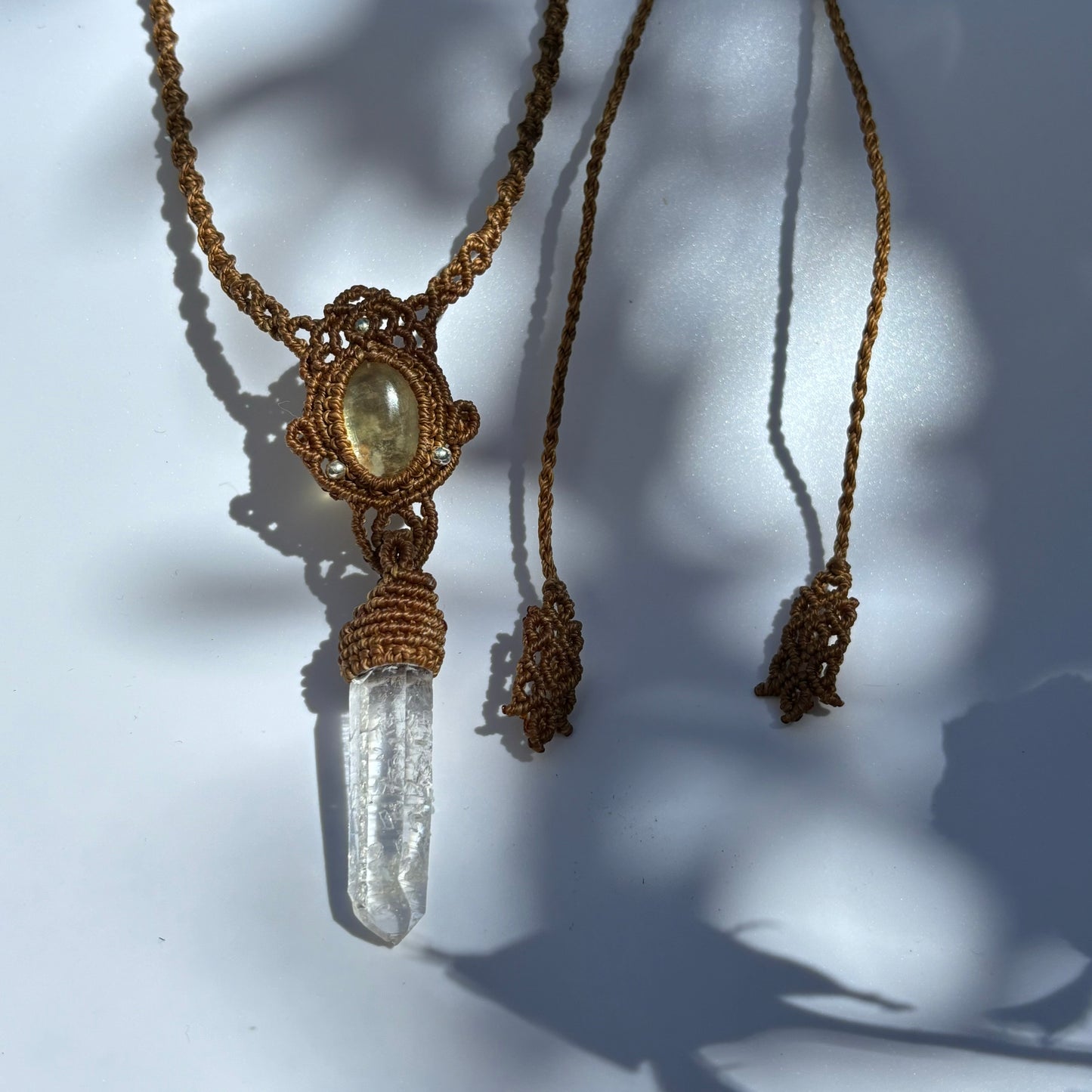 M24115 - Macrame golden lepidorite and lemurian quartz point pendant